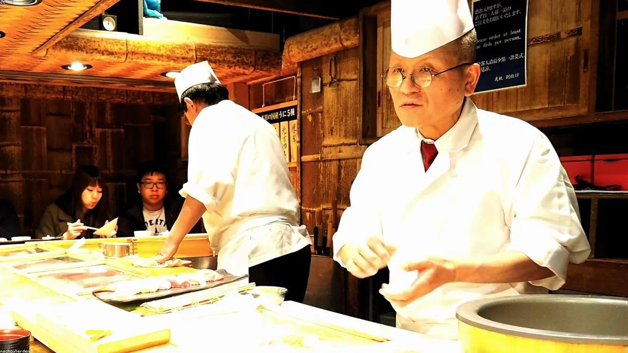 Hands forming nigiri sushi during a Kitakyushu cooking class